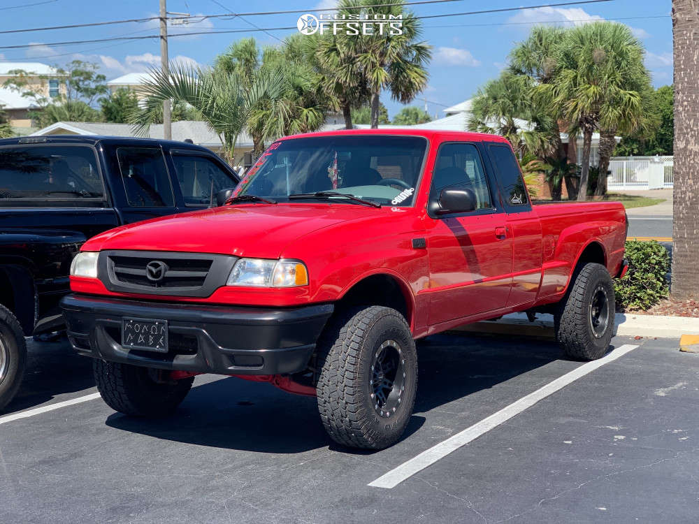 2002 Mazda B3000 with 15x8 -19 Pro Comp Series 31 and 31/10.5R15 Toyo Tires  Open Country A/T III and Suspension Lift 3" | Custom Offsets
