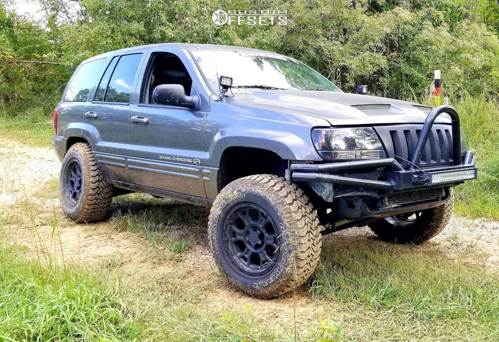 2003 Jeep Grand Cherokee with 17x9 -12 Vision Raptor and 265/70R17 Goodyear  Wrangler Authority and Suspension Lift 4" | Custom Offsets