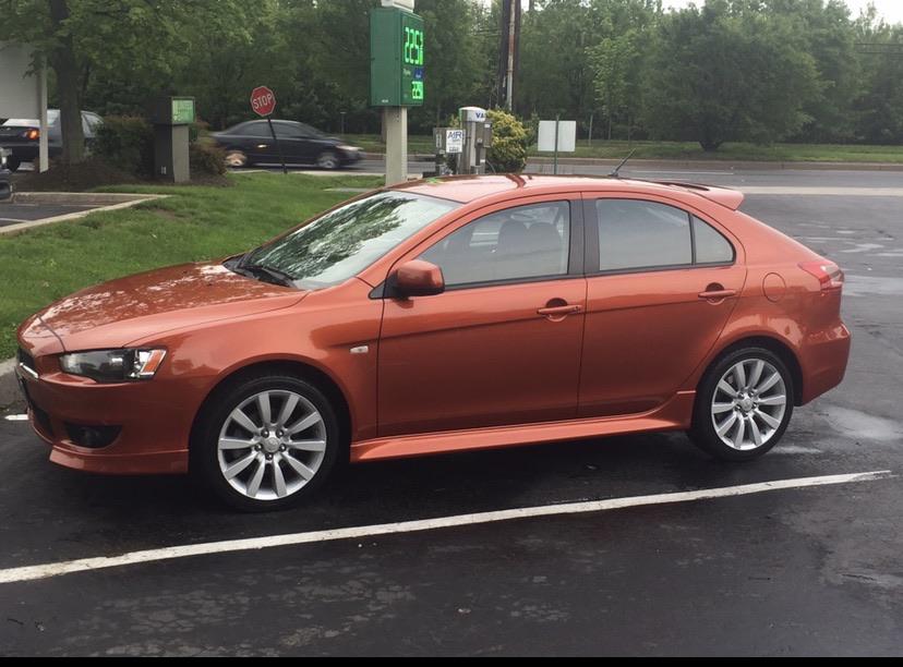 2010 Lancer Sportback GTS, practical/fun. Bought used in 2016 for 9k. Up to  142k miles and worth MAYBE 4K but still get more compliments than friends'  cars that cost 20k so I'm
